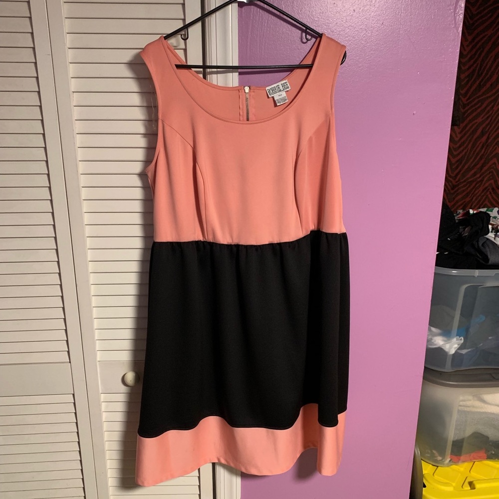 Pink and black color block dress.